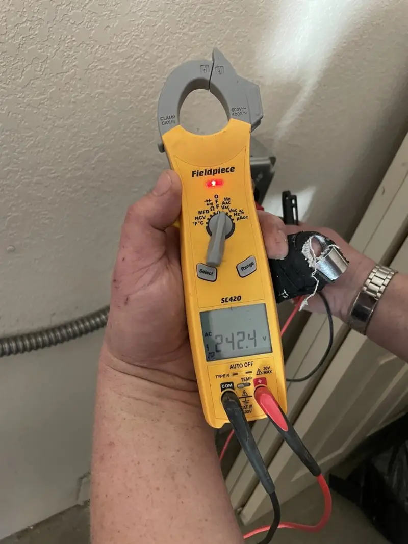 Voltage testing with clamp meter during Ceiling Fan Installation in Chanute